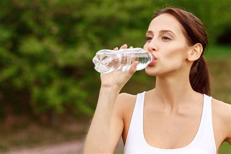 woman tests bottled water|drinking bottled water in excess.